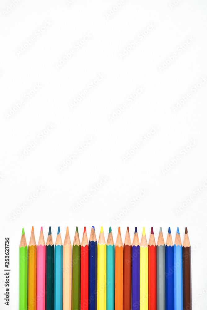 Multi - colored pencils, children's creativity, drawing colorful bright pencils on white background