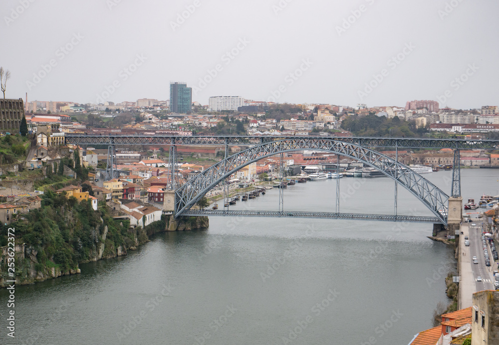 Aerial view over River Douro in Porto, Portugal. Rainy, overcast day.