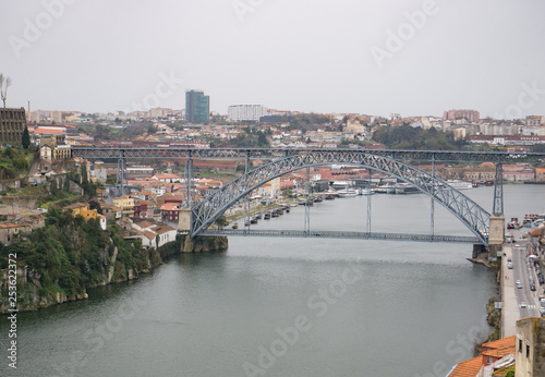 Aerial view over River Douro in Porto, Portugal. Rainy, overcast day.