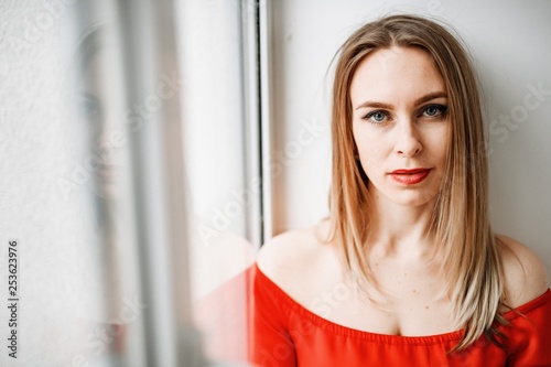 Beautiful girl in a red dress posing at the big . Free Download Beautiful girl in a red dress posing at the big . - GFXLoad
