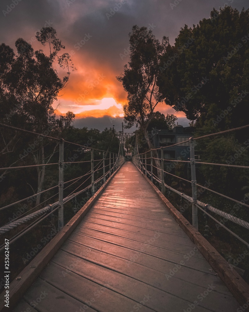 Fototapeta premium Suspension bridge at sunset