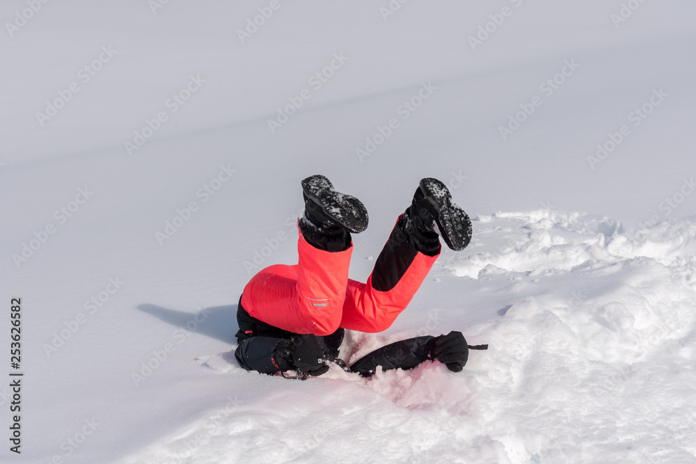 Funny photo of a girl landing in the snow