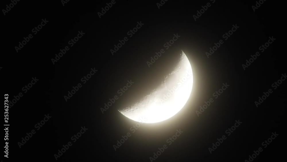 Moon in cloudy night sky