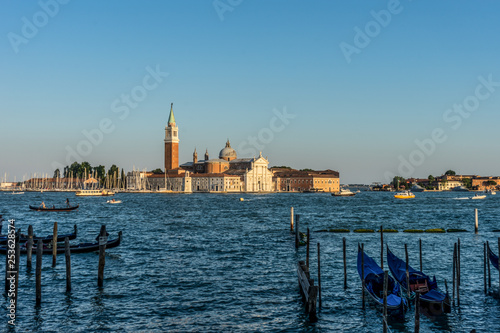 Italy, Venice, Church of San Giorgio Maggiore, BOATS IN SEA WITH BUILDINGS IN BACKGROUND