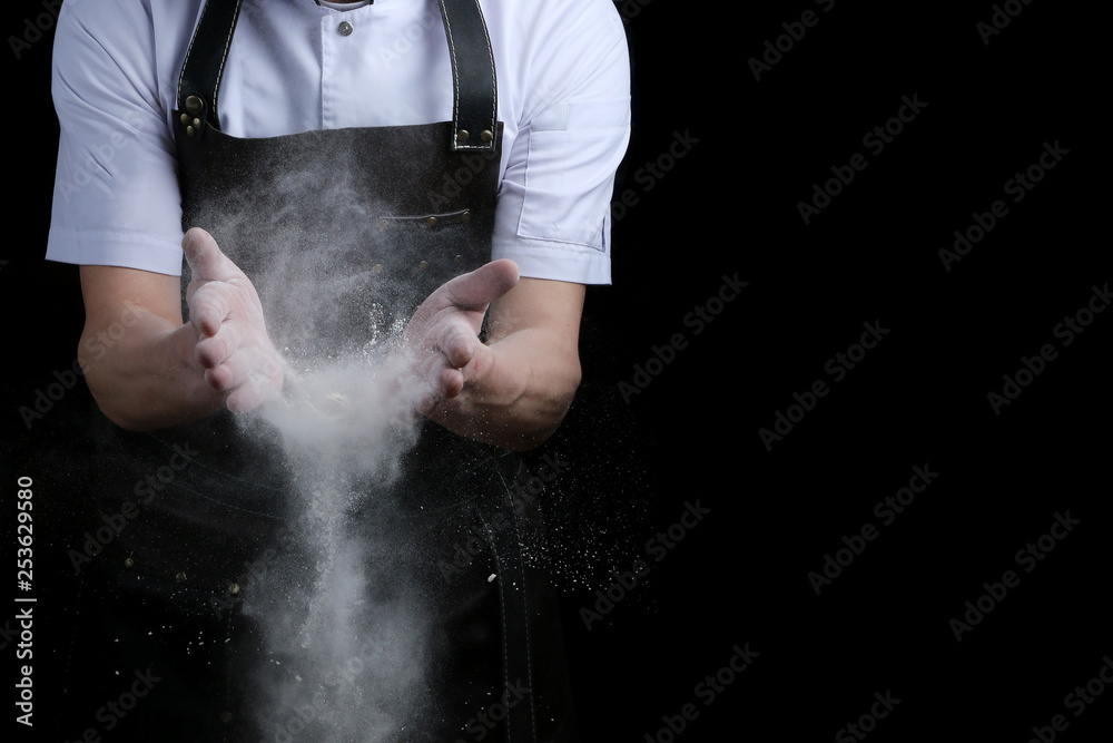 Chef hands in flour on black background. clap with flour. baking bread and and making pizza or pasta