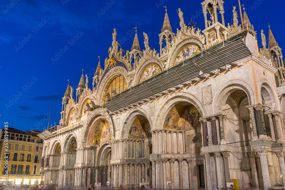 Italy, Venice, St Mark's Basilica at night, LOW ANGLE VIEW OF TEMPLE BUILDING AGAINST BLUE SKY