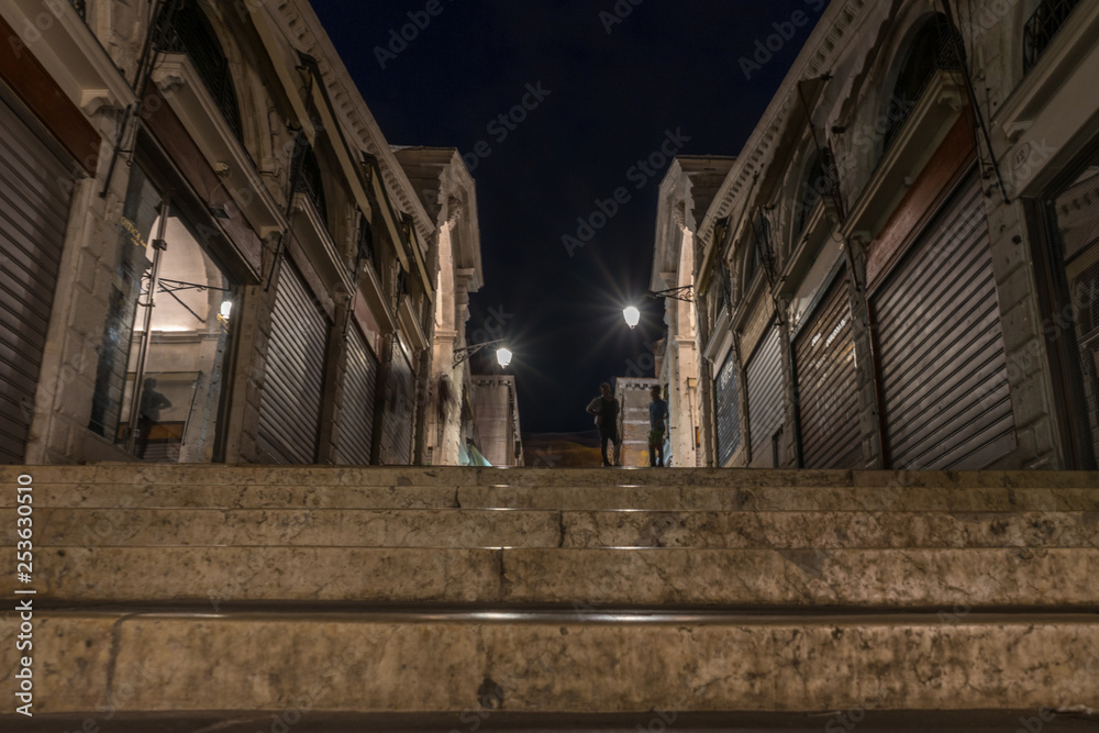 The narrow streets of Venice, Italy at night