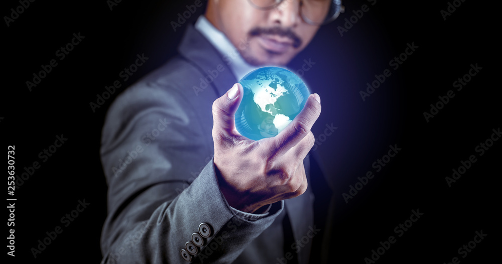 Man in suit holding glow earth with power. Man in suit holding glow earth with power.