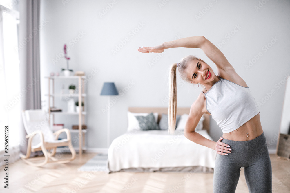 Beautiful sporty woman doing exercise at home. Beautiful sporty woman doing exercise at home.