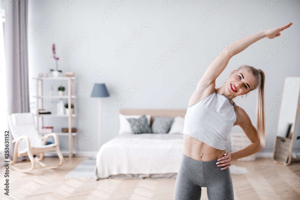 Young beautiful sporty woman at home. Young beautiful sporty woman at home.