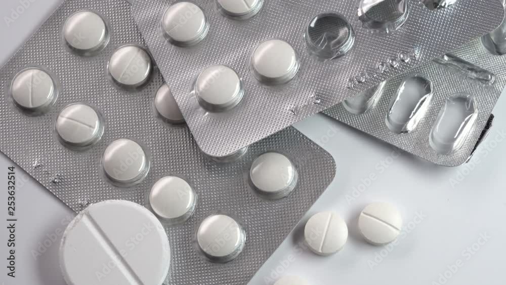 Medicine, healthcare and pharmacy concept. Pills spinning