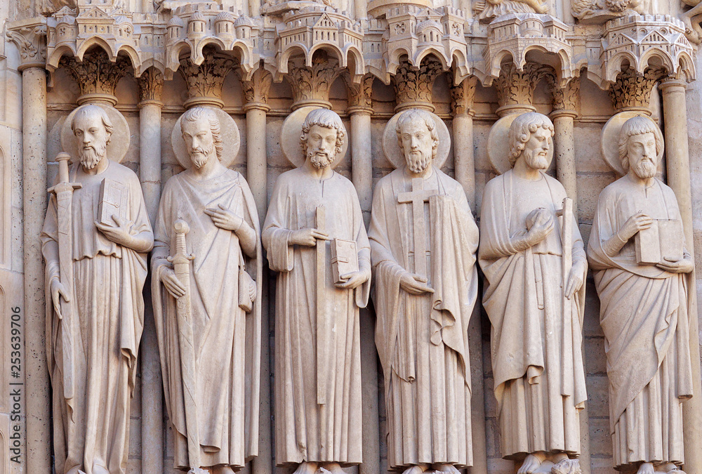 Six statues of the apostles on the western facade of Notre Dame, Paris, France