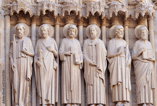 Six statues of the apostles on the western facade of Notre Dame, Paris, France