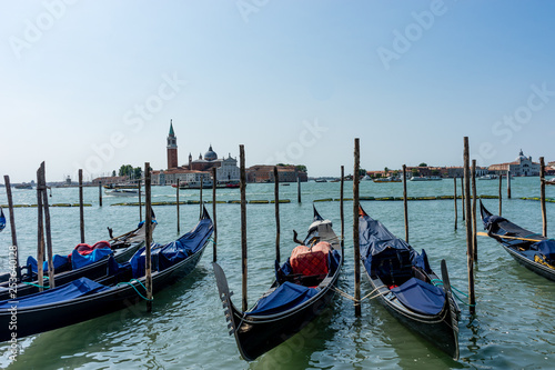 Italy, Venice, Church of San Giorgio Maggiore, BOATS MOORED IN CANAL © SkandaRamana