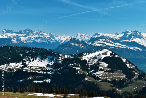 Beautiful spring panoramic view of snow-capped mountains in the Swiss Alps.