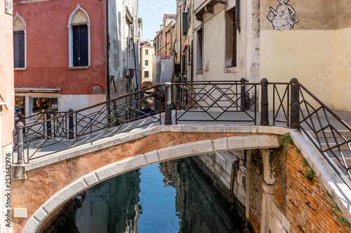 Italy, Venice, a stone bridge over a body of water © SkandaRamana