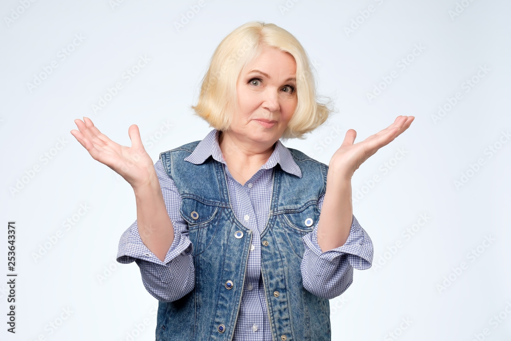 Old woman arguing and shrugging her hand Old woman arguing and shrugging her hand