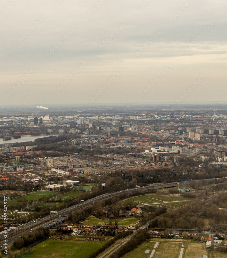 Netherlands, Hague, Schiphol, a large body of water with a city in the background
