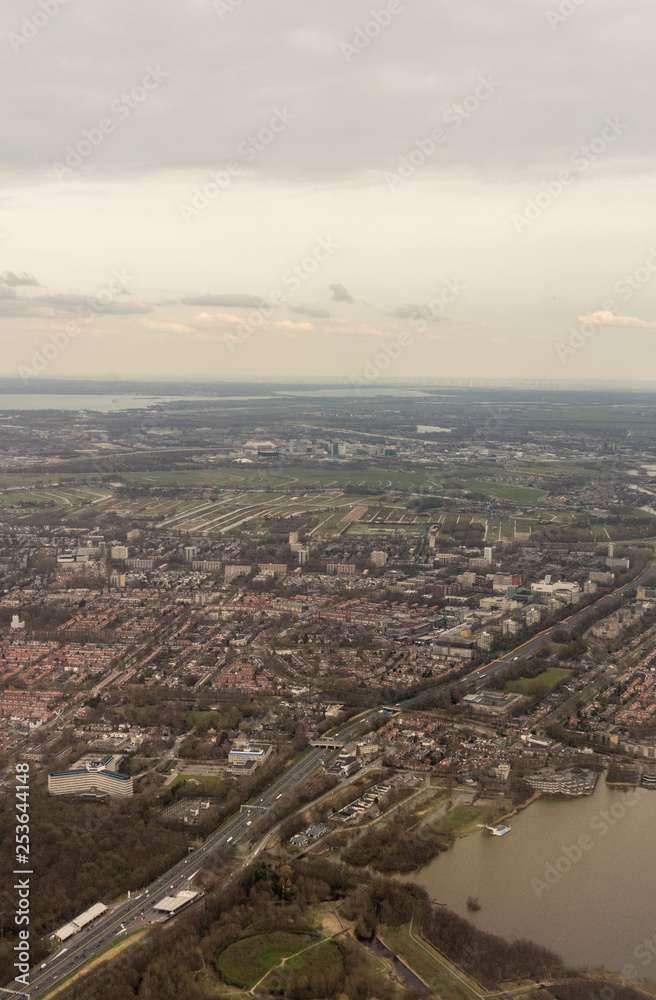 Netherlands, Hague, Schiphol, HIGH ANGLE VIEW OF RIVER AND BUILDINGS AGAINST SKY
