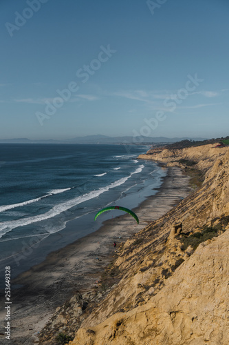 paraglider and cliffs