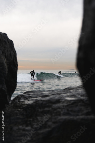 surfers with natural frame