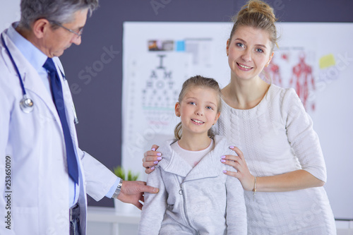 Little children with her mother at a doctor on consultation