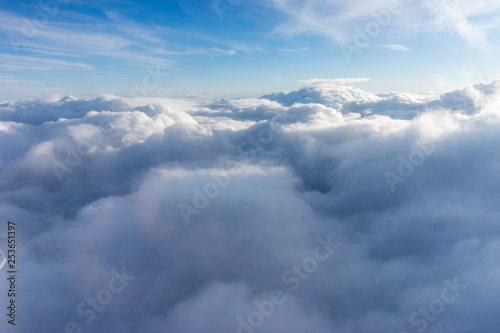Fototapeta Naklejka Na Ścianę i Meble -  View from the sky, cloud, a plane flying through a cloudy blue sky