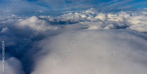 View from the sky, cloud, a plane flying through a cloudy sky © SkandaRamana
