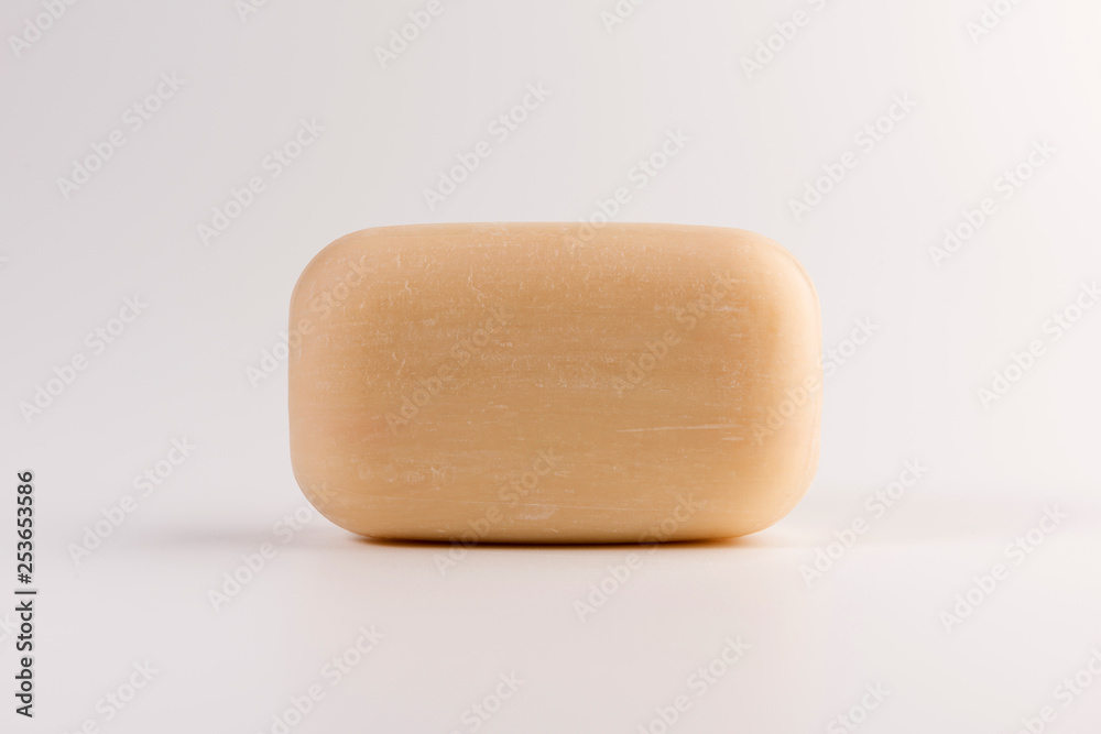 piece of beige soap isolated on a white background piece of beige soap isolated on a white background