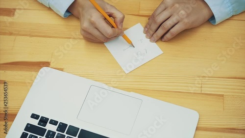 The artist paints a sketch on the present plans for life. Hands drawing with a creative workplace. photo