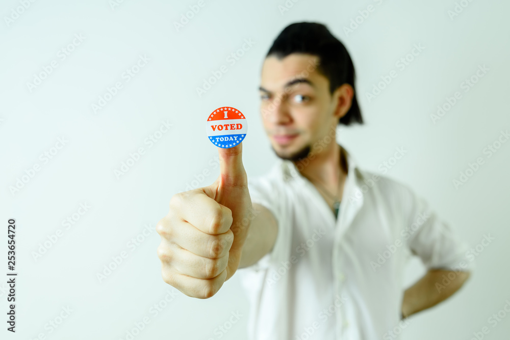 Man with sticker having voted on election day, isolated on white. Man with sticker having voted on election day, isolated on white.