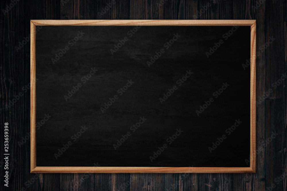 Abstract blackboard or chalkboard with frame on wooden background. Abstract blackboard or chalkboard with frame on wooden background.