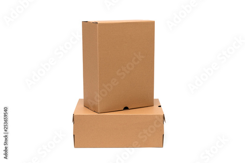 Brown cardboard shoes box with lid for shoe or sneaker product packaging mockup, isolated on white with clipping path. © pookpiik