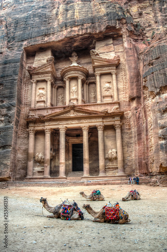 Camels laying in front of the Al Khazneh tomb also called Treasury at Petra, Jordan photo