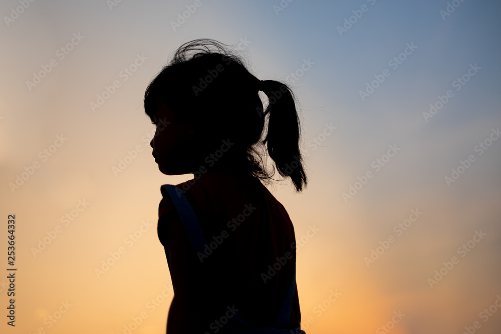silhouette of girl on the beach at sunset silhouette of girl on the beach at sunset