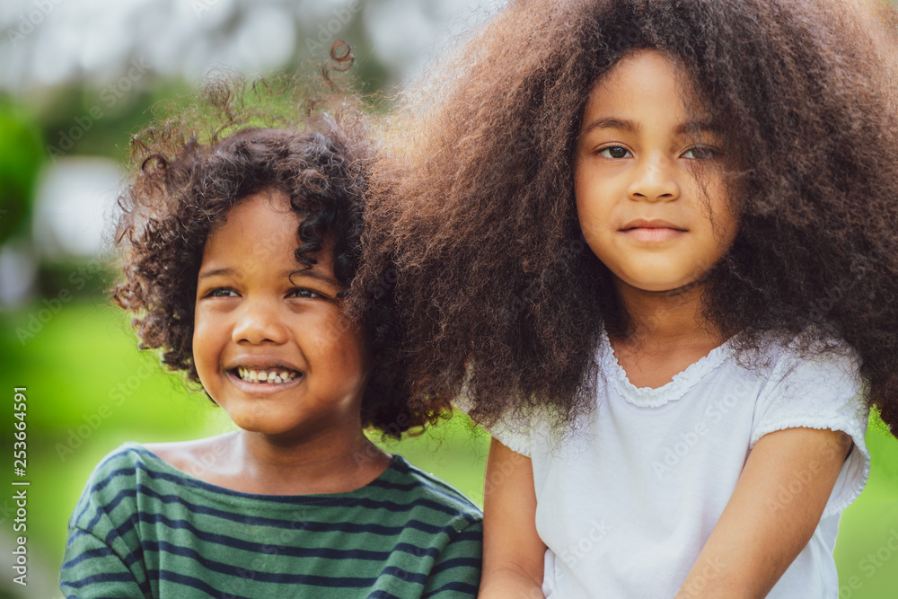 Happy African American boy and girl kids group playing in the ...