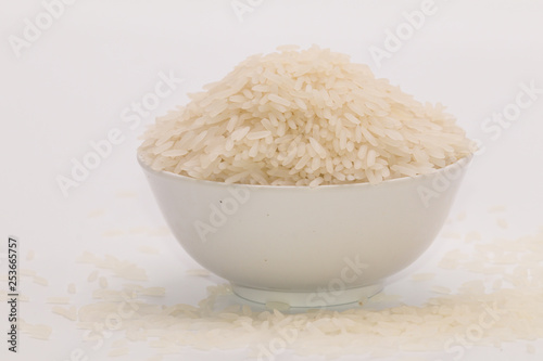 Jasmine rice in the white bowl in isolate white background.