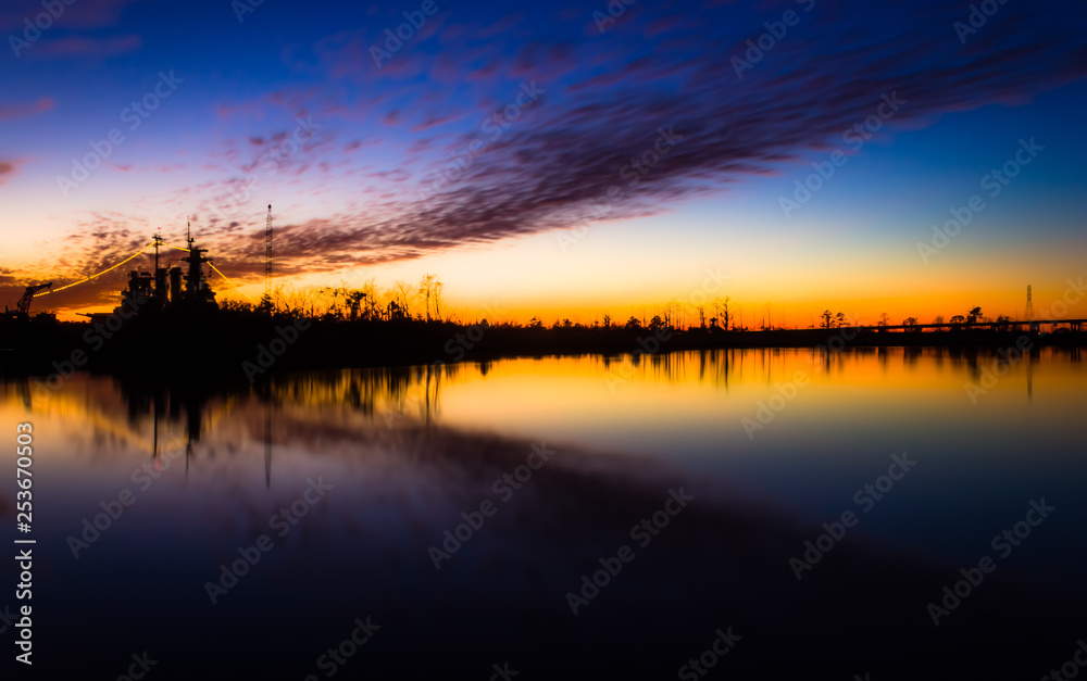 Sunsetting behind ship