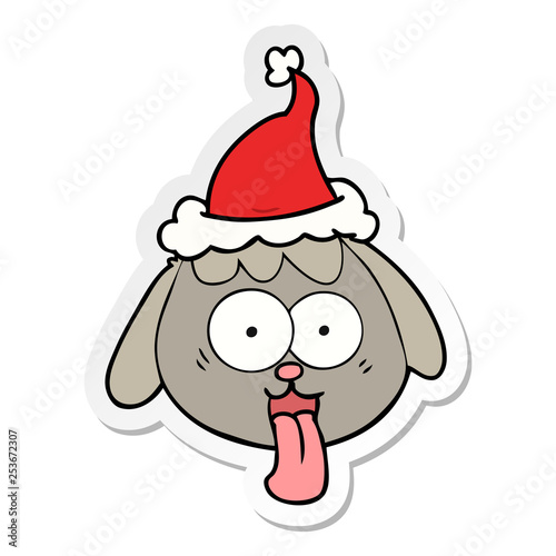 sticker cartoon of a dog face panting wearing santa hat