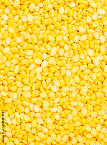 yellow split mung dal or moong dal pile isolated on white background