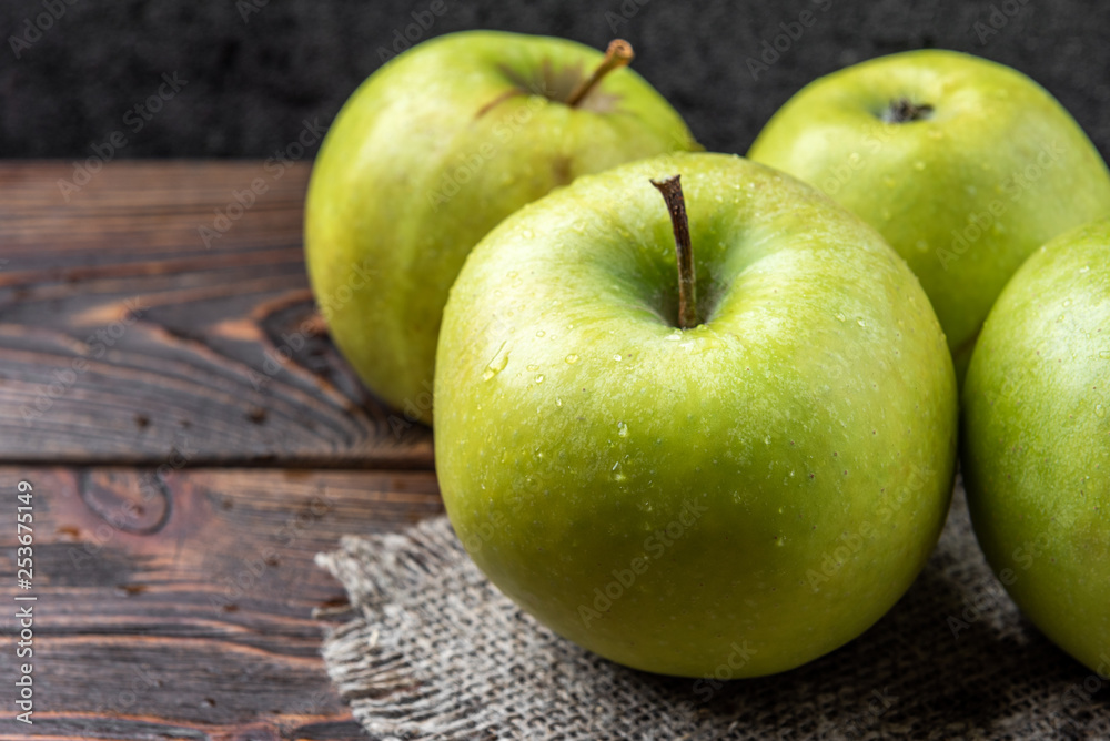 Green apples on dark wooden background. Green apples on dark wooden background.