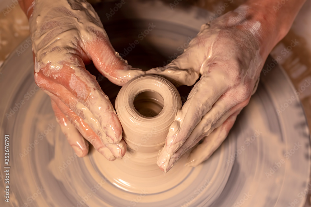 Professional potter making bowl in pottery workshop Professional potter making bowl in pottery workshop