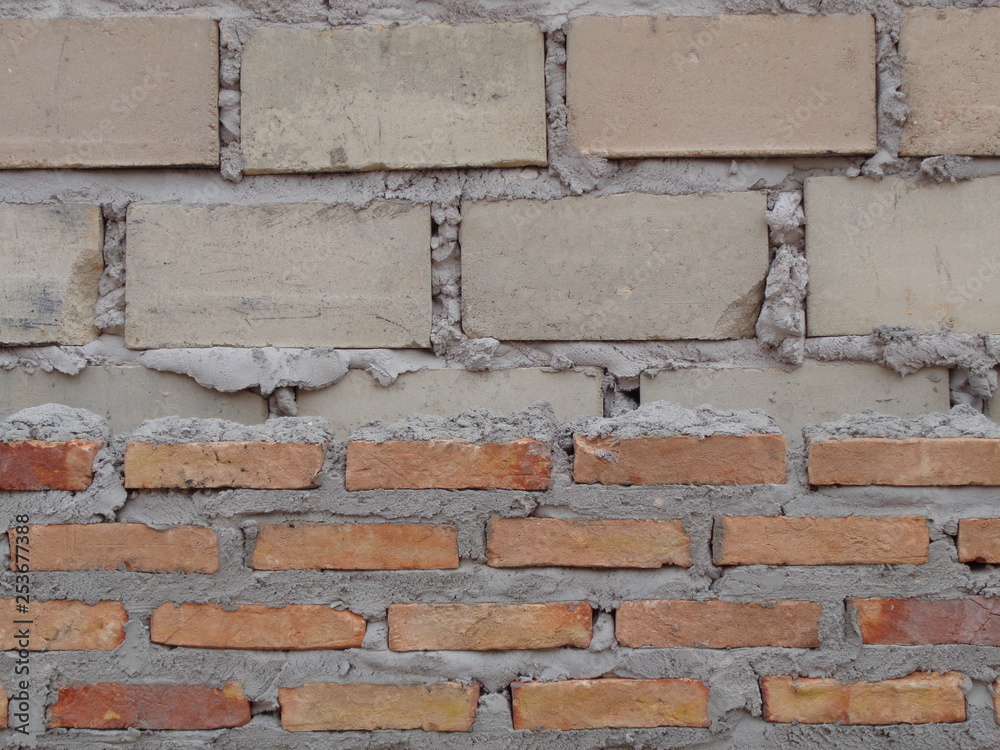 Brick wall before plastering or under construction Brick wall before plastering or under construction
