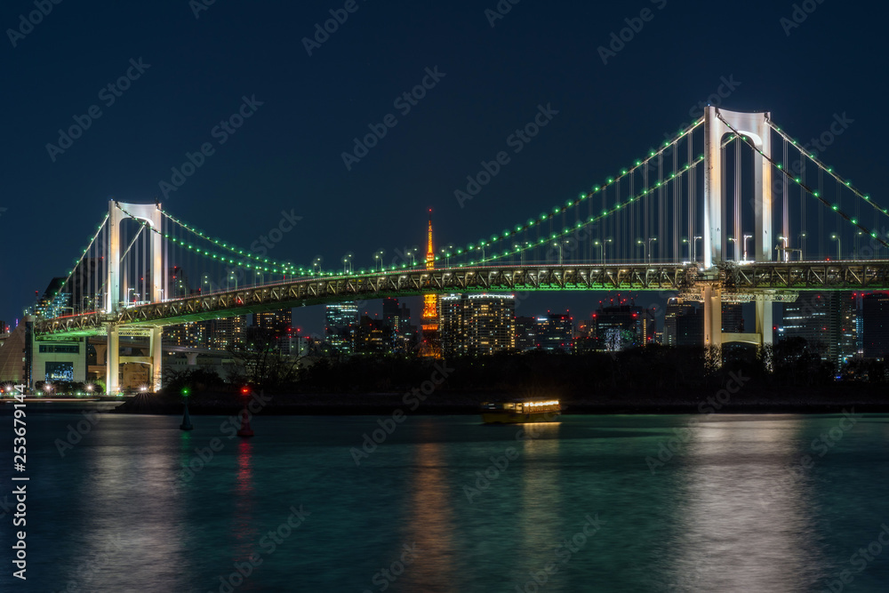 Scene of Tokyo Rainbow bridge which can see tokyo tower at the twilight time, Odaiba, Japan
