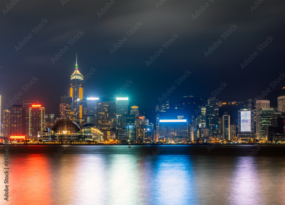 Hong Kong harbour by night with long exposure mode. Night scene with neon lightings