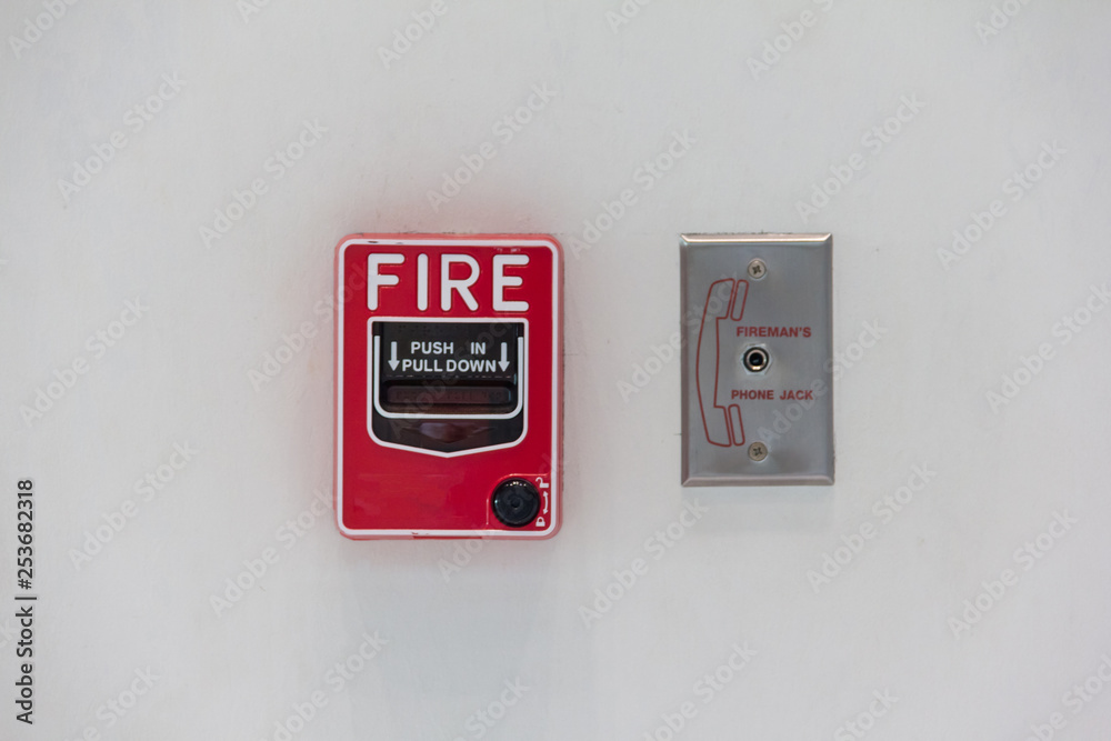 red fire alarm switch attach with white wall red fire alarm switch attach with white wall