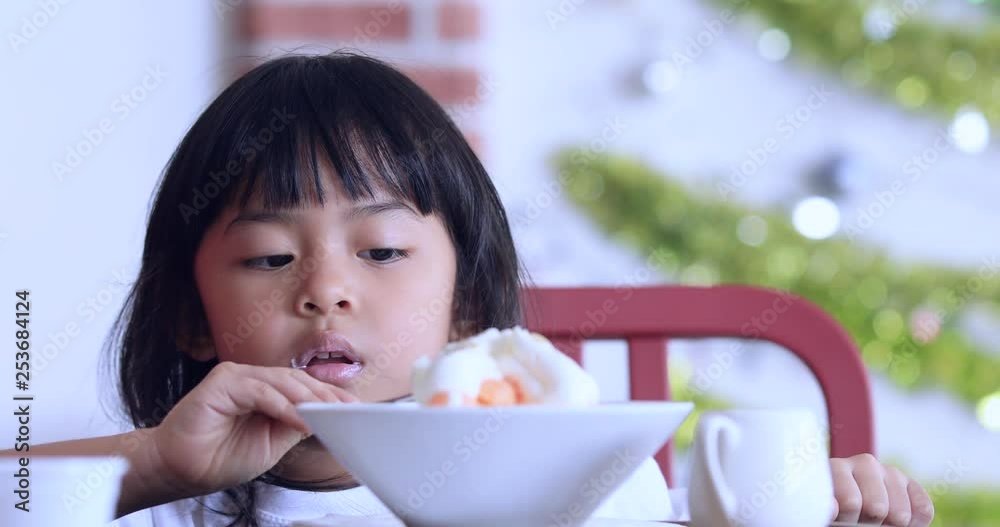 Cute Girl Eating Ice-Cream,little girl with ice cream on colorful background,Asian kid eating ice cream Cute Girl Eating Ice-Cream,little girl with ice cream on colorful background,Asian kid eating ice cream
