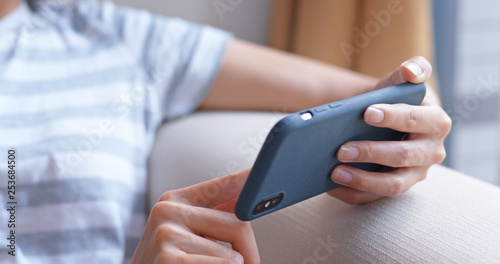 Close up of woman watch on smart phone