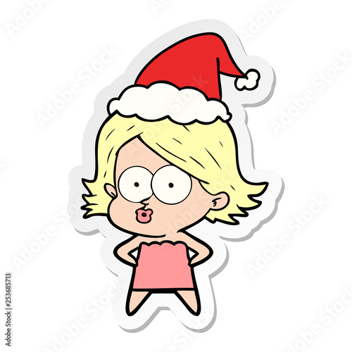 sticker cartoon of a girl pouting wearing santa hat