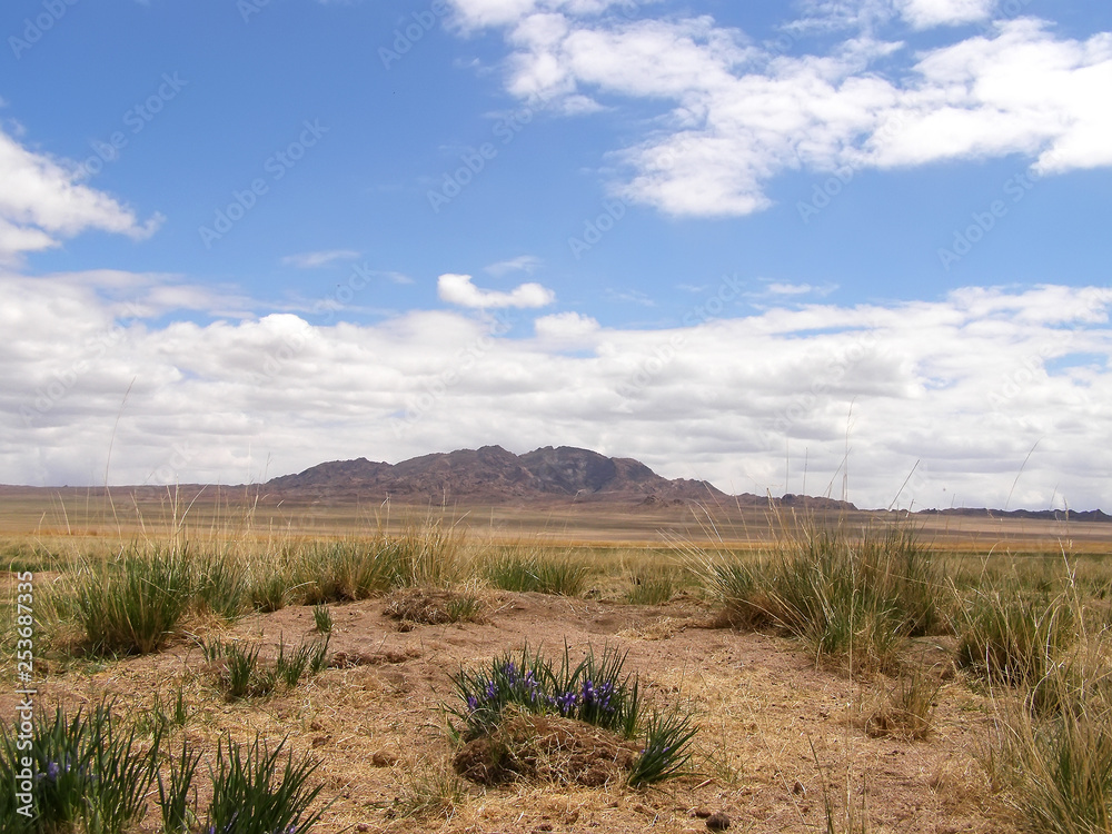 Mongolian natural landscapes surrounded by mountains and rocks.